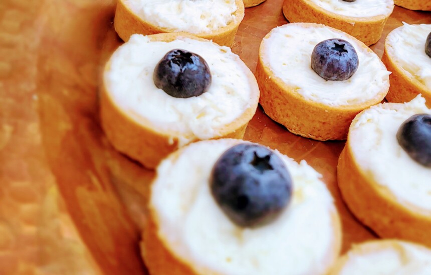 tray of mini desserts with blueberries