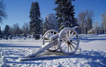 old cannon covered in snow