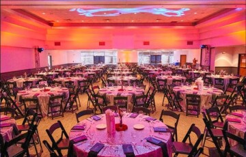 Room with tables and chairs in a colorful setting