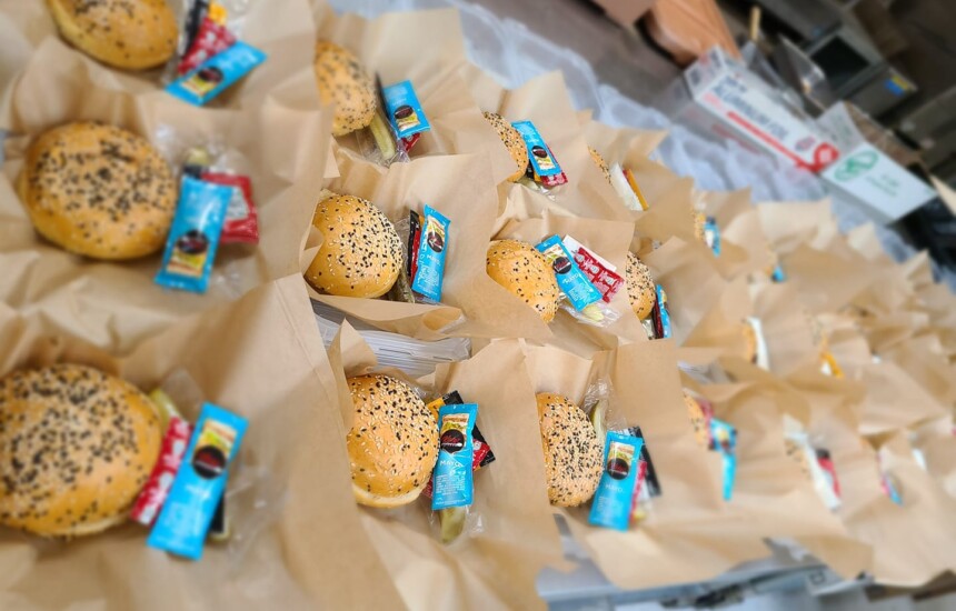 burgers in burger boat with condiments