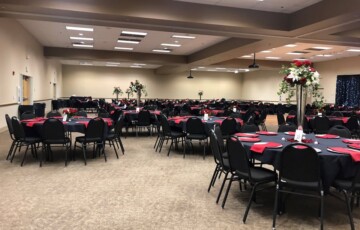 tables with black and red table settings