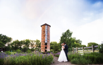 couple kissing infront of silo